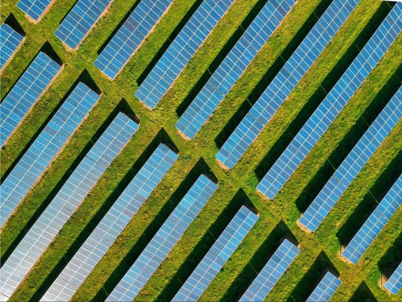 A surge in renewable energy (solar panels) to address the global energy crisis