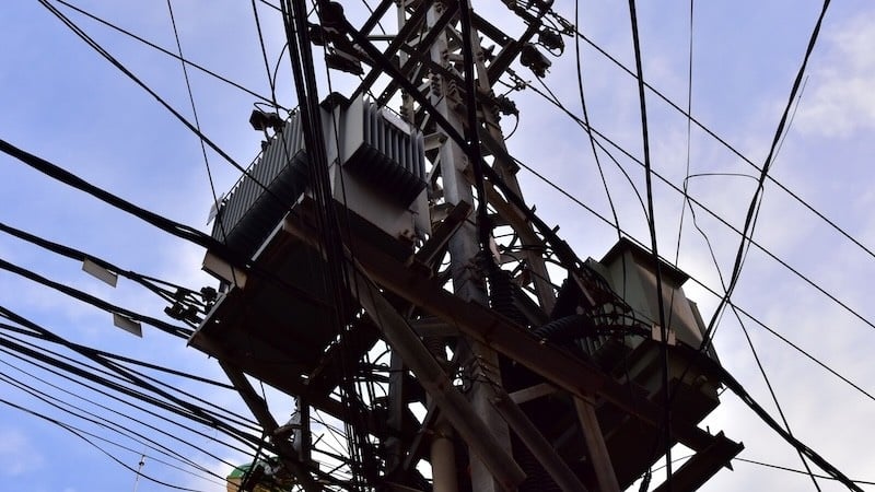 Step-down transformer on an electricity transmission tower. 