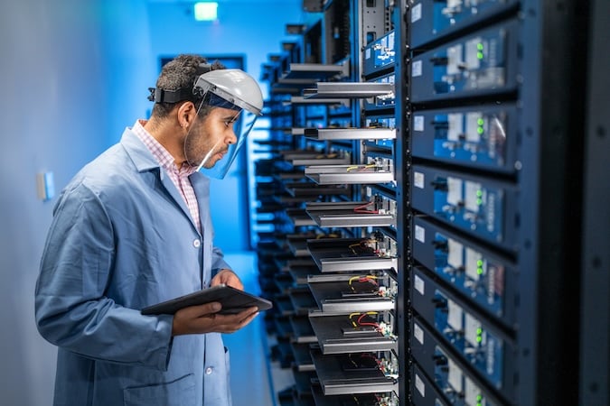 Iontra employee inspects batteries