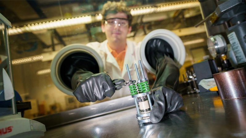 Researcher Grayson Deysher with experimental battery.
