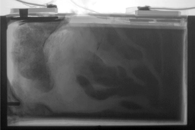 Still image from an X-ray video recorded during a nail penetration test of a prismatic lithium-ion cell.