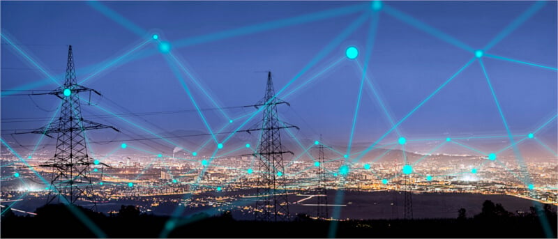 High power electricity poles in urban area connected to smart grid. Energy supply, distribution of energy, transmitting energy, energy transmission, high voltage supply concept photo.