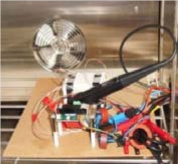 Calorimeter set-up for analysis of the power losses in the output choke with sensors and terminals (bottom)
