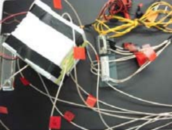 Calorimeter set-up for analysis of the power losses in the output choke with sensors and terminals (top)