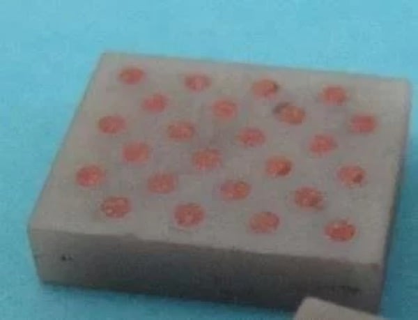  Ceramics with Vias and filled with copper, top, and bottom not metalized so that Vias are visible