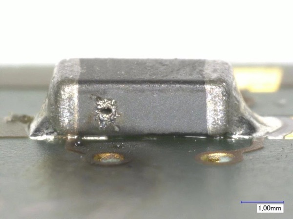 Melted and burned chip bead ferrites due to overcurrent and overheating (top)
