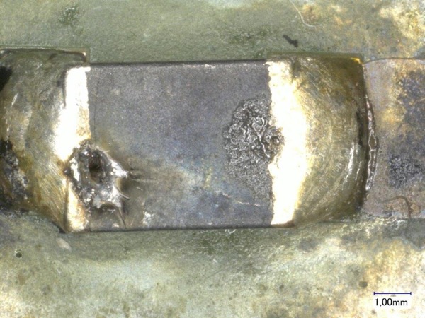 Melted and burned chip bead ferrites due to overcurrent and overheating (middle)