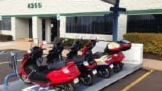 Mini-fleets of Electric Super Scooters Docked to a Solar Charging Station