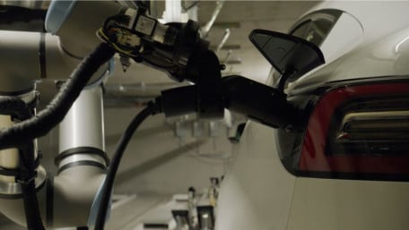 Humans Not Required: Robotic Arms Charge EVs While Parked