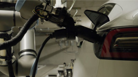 Humans Not Required: Robotic Arms Charge EVs While Parked